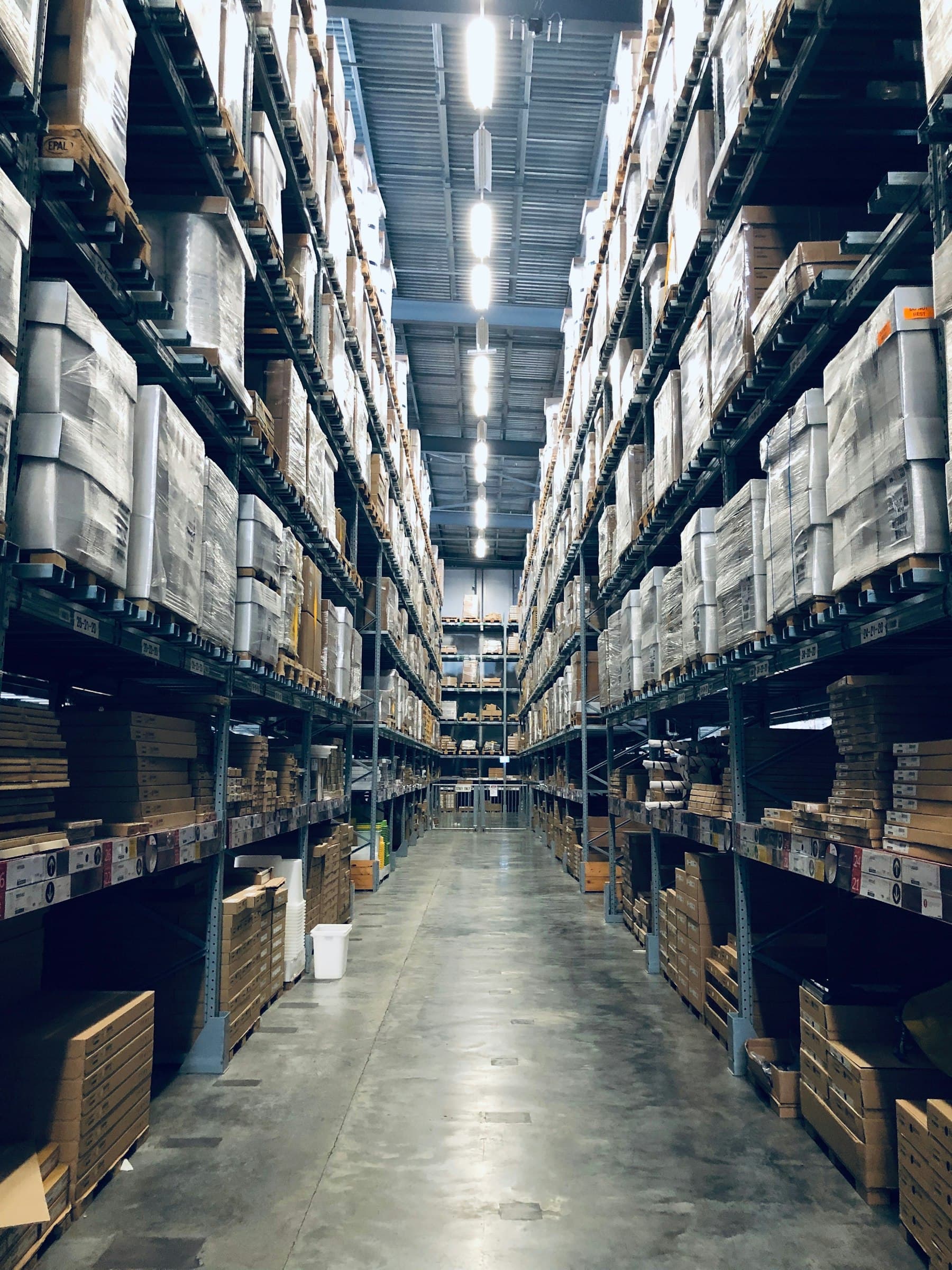 Logistics and supply chain operations — warehouse with stacked pallets
